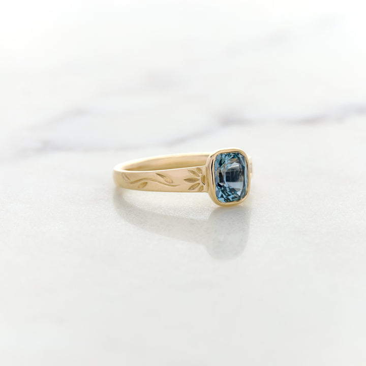 Asymmetrical Band Design for a Blue Sapphire