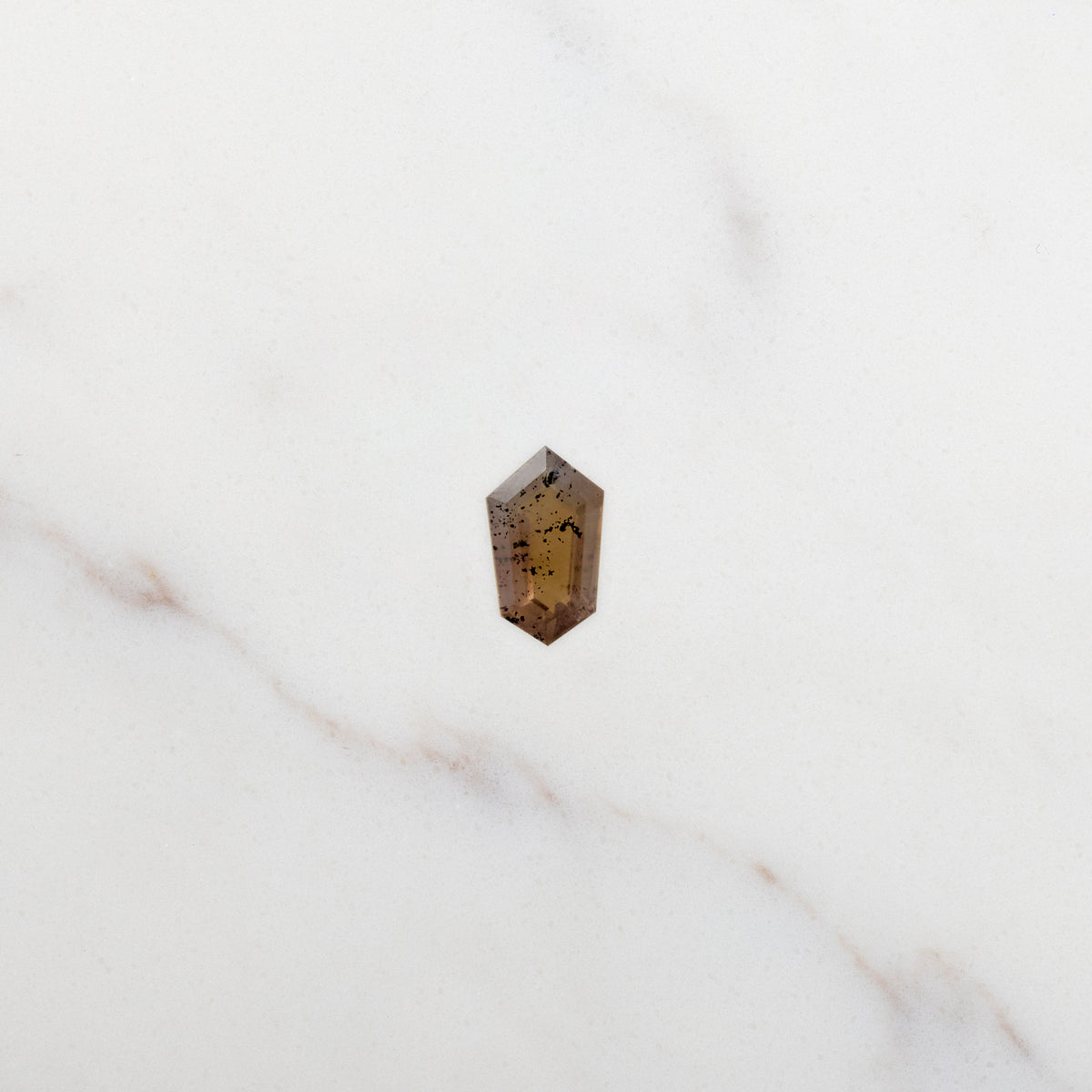 1.07ct Shield Cut Brown Natural Galaxy Sapphire