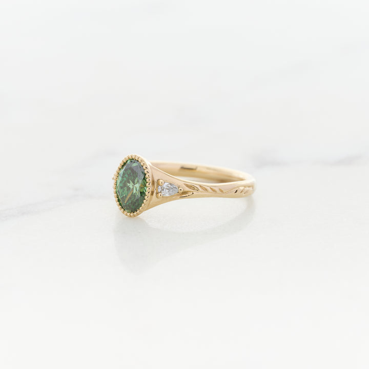 Green Diamond in an Engraved Band