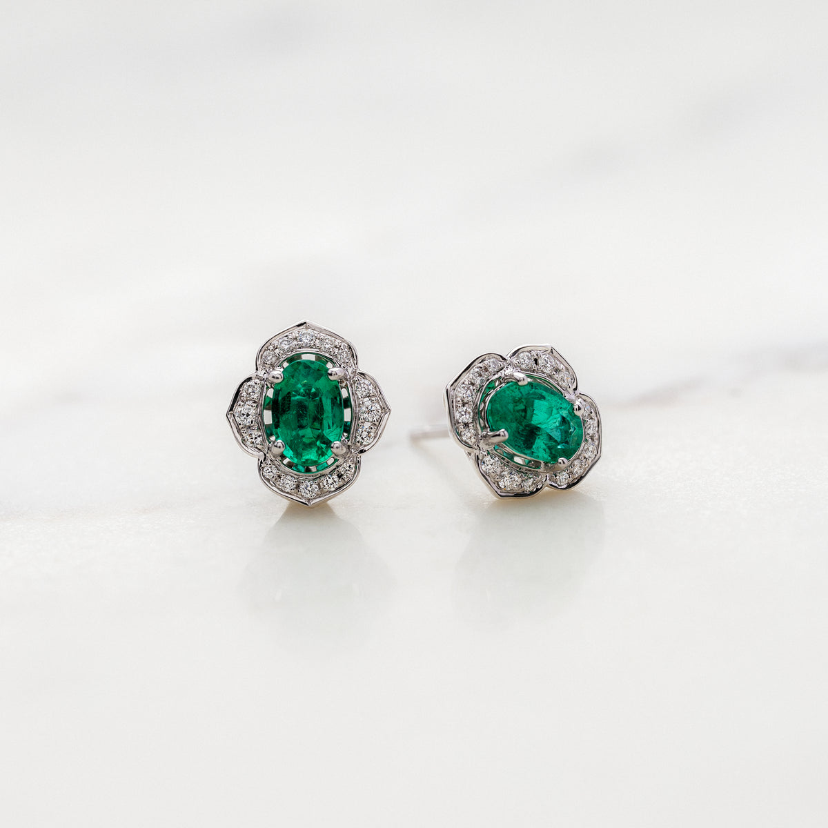 Oval Emeralds with Floral Halo Stud Earrings